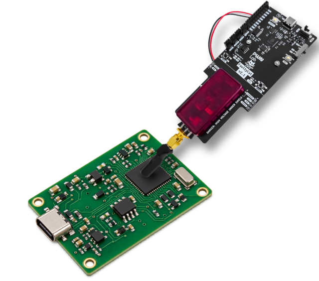 FaultyCat fault-injection probe on the main chip of a device under hardware security audit